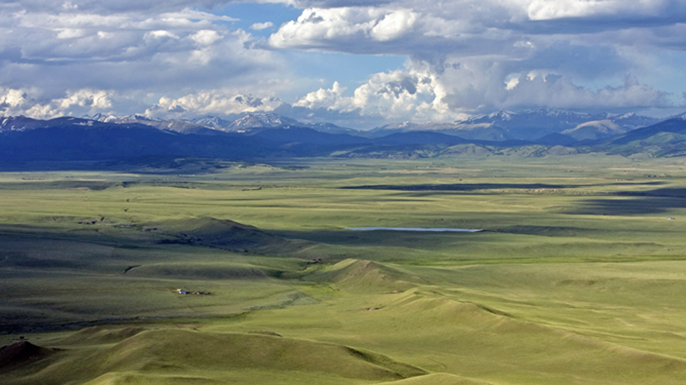 South Park aerial view of vast valley and mountains in background