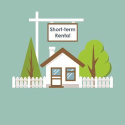 House with tree's, fence and Short Term Rental sign